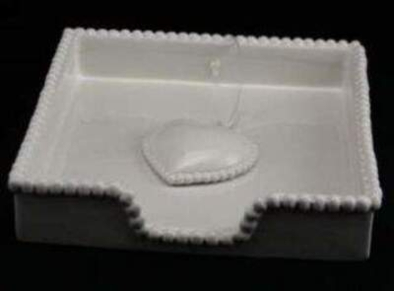 This white ceramic napkin holder by Gisela Graham would make a great house warming gift. Bead effect around the edge and a heart on a ribbon as the weight to keep the napkins in place. Size 18x3.5x18cm